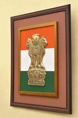Gold-toned Ashoka stambh sculpture in wall frame with tricolour backdrop
