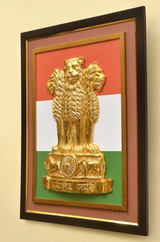 Gold Ashoka lion emblem centerpiece on tricolour backing inside wooden frame