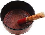 Brass singing bowl with red mallet and carved interior detail, 6-inch height