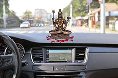 Lord Shiva dhyan mudra resin idol on car dashboard, gold-tone trident and drum