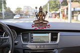 Small Lord Shiva dhyan mudra resin idol on dashboard, gold-tone trident and drum