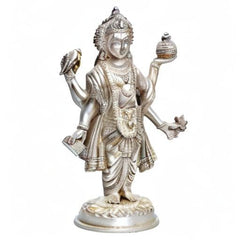 Silver Dhanvantari brass statue standing with raised hands and ornate headdress