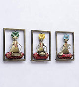 Three iron musician wall frames with green, yellow, and blue outfits and red decorative bases