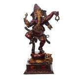Dancing Ganesha figurine on square base, raised arms and curved legs