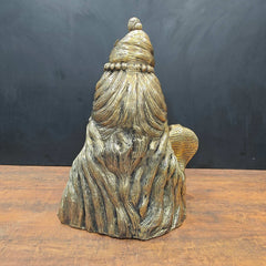 Brass Shiva head bust back view, coiled hair and stacked jewelry detailing