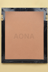 Back view of wall frame with black backing sheet and corner brackets