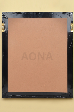 Back view of wall frame with black backing sheet and corner brackets