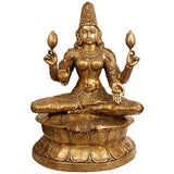 Brass Lakshmi idol, seated on lotus with four arms holding flowers