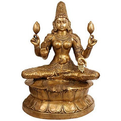 Brass Lakshmi idol, seated on lotus with four arms holding flowers