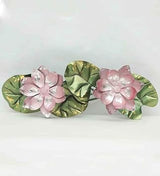 Decorative iron lotus flowers: pink blooms with textured green and gold leaves