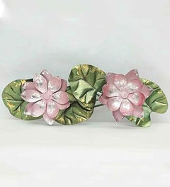 Decorative iron lotus flowers: pink blooms with textured green and gold leaves