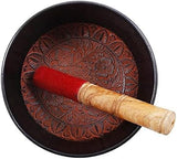 Tibetan singing bowl interior with carved design and red mallet tip, 6-inch