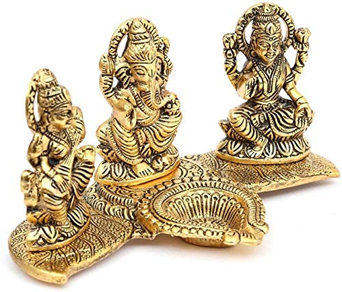 Ganesha Lakshmi and Saraswati Idol Sculpture Seated On Banana Leaf Throne Golden Height 11 Cm Width 20.0 cm