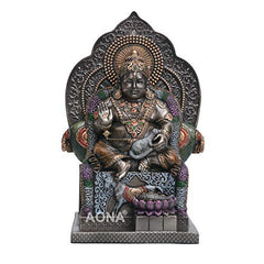 Lord Kuber resin idol, seated pose with raised hand and detailed jewelry, 5.5 in height.