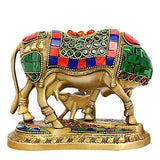 Brass cow and calf deity idol, side view, decorated saddle with green circle patterns