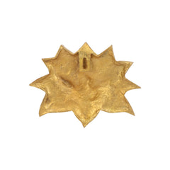 Brass lotus wall decor detail, close-up of textured backplate