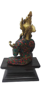 Rear view Saraswati brass idol, multicolor patterned robe, seated on pedestal base