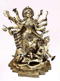 Brass Maa Durga idol with many arms, ornate crown, and weapons, seated on demon