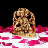 Brass Dattatreya-Laxmi idol, front view of seated deity on pedestal
