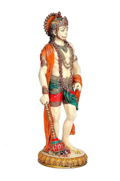 Lord Hanuman statue side view, orange sash drape and ornate chest detailing