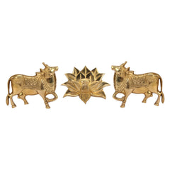Brass cow pair with lotus wall decor, front view of three relief figures