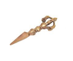 Brass furba phurpa side view: pointed tip and carved handle with dorje vajra hilt