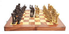 Wooden chessboard showing brass and dark Roman pieces on alternating squares