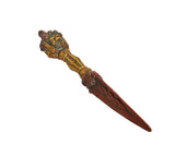 Ornate furba phurpa dagger pendant with gold-toned handle and pointed brown tip