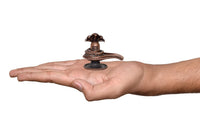Copper Shiva ling Sheshnaag figurine in open palm, size reference