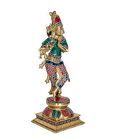 Messing-Krishnafigur, seitliche Ansicht mit grüner Tunika und rotem Hosenmuster