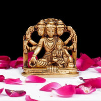 Brass Dattatreya-Laxmi idol, seated figure in ornate arch, 2.5 inch