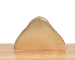 Back view of small brass Gaja Lakshmi idol, smooth arched base