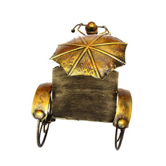 Back view metal ant rickshaw figurine, umbrella canopy and curved wheel supports