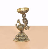 Brass peacock oil lamp stand statue, decorative scrolls and raised bowl