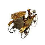 Front close-up iron ant rickshaw showpiece with umbrella top, gold and dark bronze accents