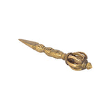 Brass Dorje Vajra Furba angled view with ornate grip and pointed tip