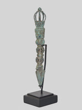 Bronze phurpa dagger with turquoise patina, crown finial and stacked figurines on stand