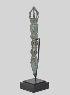 Bronze phurpa dagger with turquoise patina, crown finial and stacked figurines on stand
