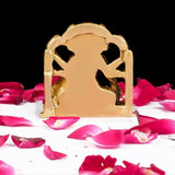 Brass Dattatreya-Laxmi idol, back view with cutout arch design