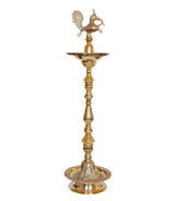 Brass oil lamp stand with peacock topper and ornate tiered stem, round base