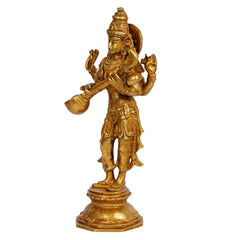Side view of gold-tone Maa Saraswati standing statue with four arms and layered garments