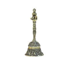 Brass pooja bell with seated Hanuman figure, detailed engraved bell body