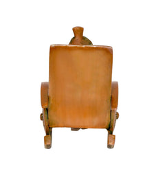 Back of brass Ganesha statue on chair, turban figure and carved backrest