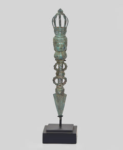 Vintage bronze phurpa ritual dagger with crown top and carved figures on dark base