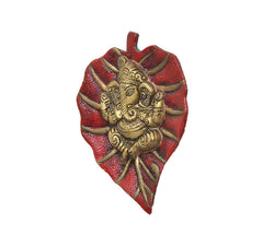 Metal Ganesha wall hanging front view, heart-shaped red and gold relief detailing