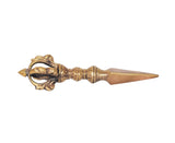 Brass furba phurpa lengthwise view, pointed tip and ornate dorje vajra guard