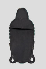 Back of black wooden Buddha mask wall hanging with two hanging openings at the bottom