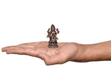 2.5-inch copper Kal Bhairav idol shown in hand, standing on lotus base