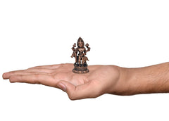 2.5-inch copper Kal Bhairav idol shown in hand, standing on lotus base