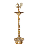 Brass peacock diya stand with central flame tray and round pedestal base